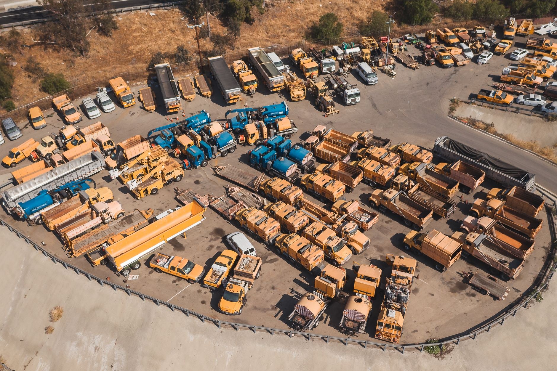 Heavy vehicle fleet lined up at a depot (sample image, replace with a real fleet photo)